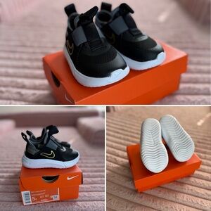 Nike Kids Black Sneakers with Gold Accents